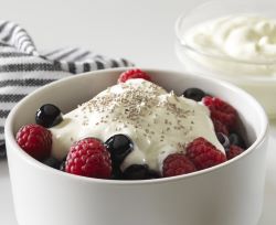 Greek yogurt topped with berries and chia seeds